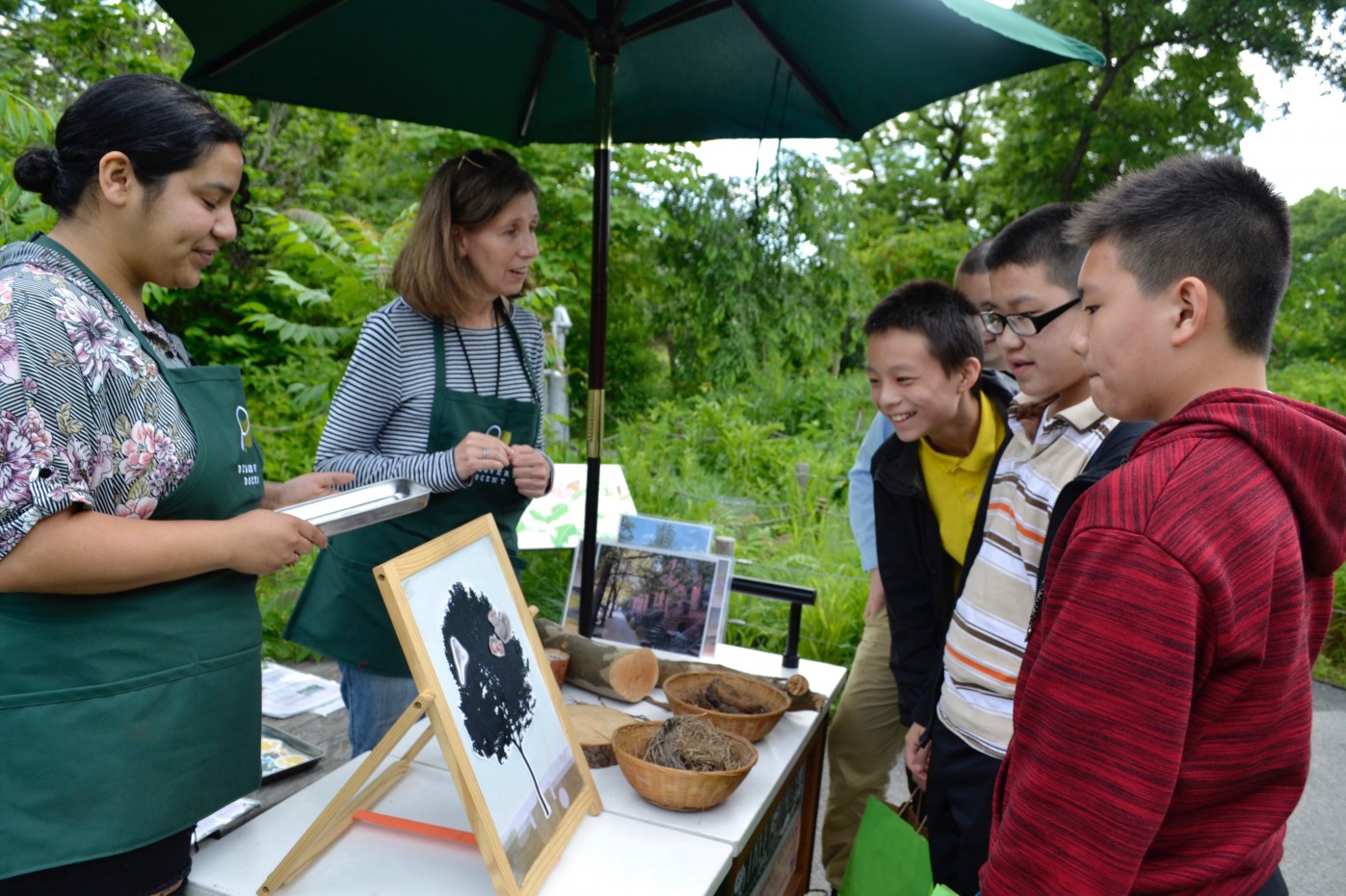 Discovery Docents engage with visitors at an activity station. Photo by Blanca Begert.